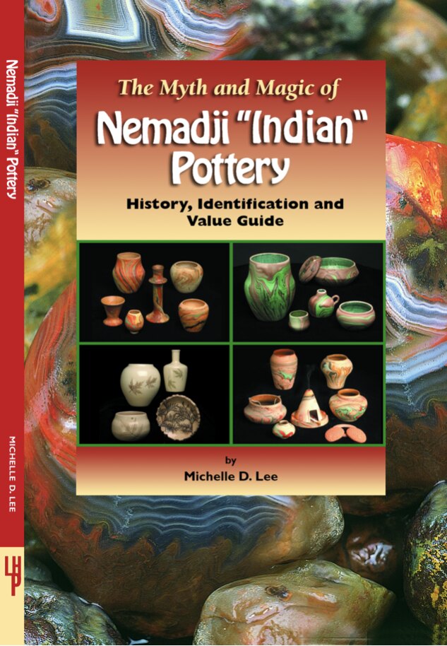 The Myth and Magic of Nemadji Pottery book resting with colorful Nemadji pottery